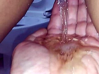 Homemade asian couple explores watersports in private setting