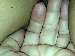 Homemade asian couple explores watersports in private setting