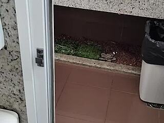 What lurks inside this public bathroom toilet stall? Solo amateur strokes small cock outdoors.