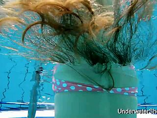 sexy teen flaunts nude body underwater