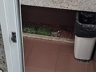 What lurks inside this public bathroom toilet stall? Solo amateur strokes small cock outdoors.