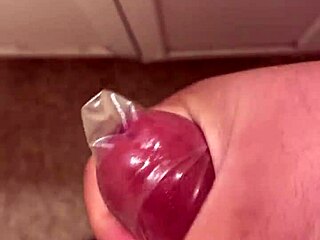 Masturbating creamy pussy with condom for intense solo orgasm explosion