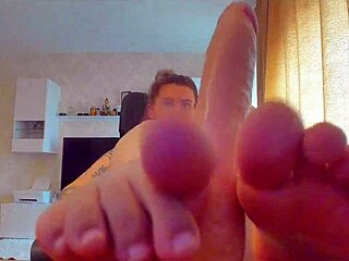 big titted babe sucks huge dildo then gives footjob tease