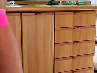 Ivy Edera fingers her wet mature pussy and big tits right in the kitchen slut style