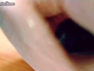 she grabs those gloves and strokes the massive black dildo close-up pov till it's throbbing wet and ready