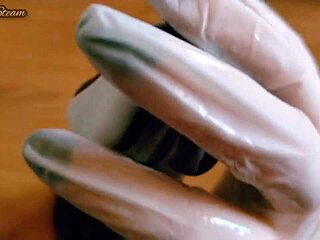 she grabs those gloves and strokes the massive black dildo close-up pov till it's throbbing wet and ready