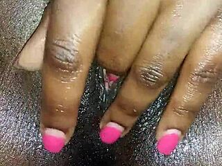 Yo, check out this black ebony babe rubbing her wet pussy up close.