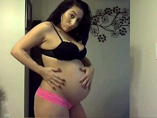 Cute Pregnant Woman Displays Her Sexy Round Belly
