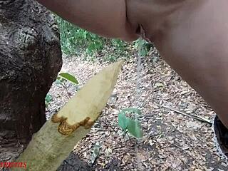 Naughty bbw squirts on wooden stake in forest