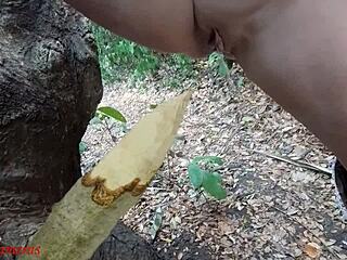 Naughty bbw squirts on wooden stake in forest