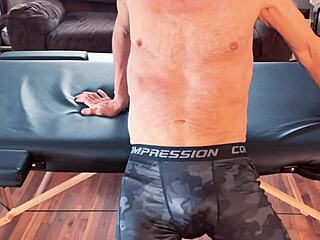 Skinny Bodybuilder Stretches In Tight Leggings On Massage Desk Hd