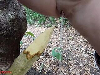 Naughty bbw squirts on wooden stake in forest