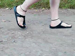 Chubby German hiker struts fat feet in Birkenstocks through wild outdoor trails barefoot style