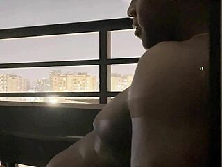 Roommate brunette deepthroats big cock on hotel balcony in amateur couple blowjob