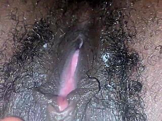 Ebonys juicy pussy drips wet on bed as she masturbates feet up to orgasm.