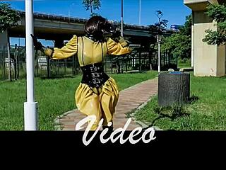 bound asian doll in gas mask endures latex rubber b play with handcuffs and corset bondage