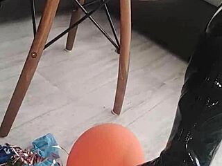 her latex stockings hug those big tits as balloon pops