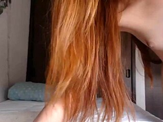 i'm stuttering over this hot redhead's dildo play