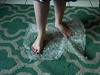 brunette nerd sways barefoot to music teasing her perfect toes