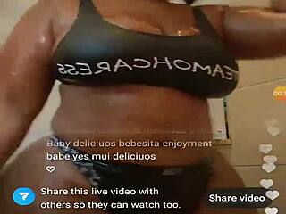 A BLACK EBONY woman steps into the SHOWER, her big ASS glistening wet under the water.