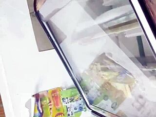 A sneaky upskirt spy catches glimpses under her skirt in the bustling store