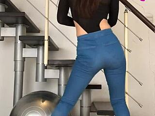 Chinese babe dances seductively in tight jeans