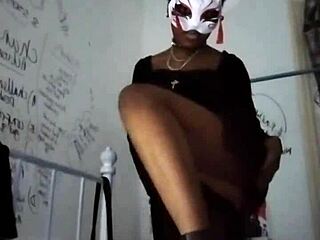 Goth dominatrix teases natural tits in high heels to drain balls