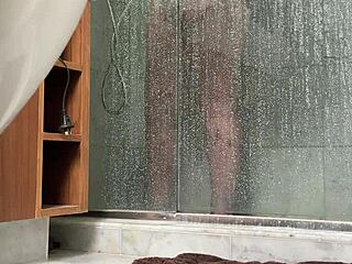 bbw gets busted stroking fat pussy in steamy shower