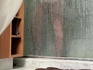 bbw gets busted stroking fat pussy in steamy shower