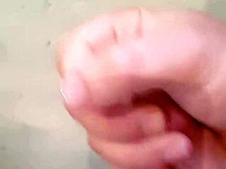 showering stud strokes his monster cock until massive cumshot erupts