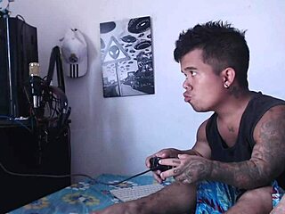 While the little guy plays video games his horny stepsister sneaks in craving his cock play