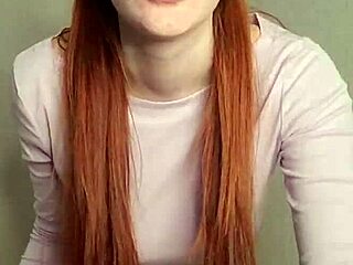 Redhead puffs smoke casually showing off her fiery vibe