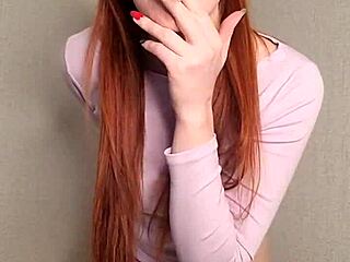 Redhead puffs smoke casually showing off her fiery vibe