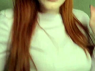 Redhead puffs smoke casually showing off her fiery vibe