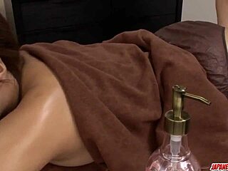 Maika enjoys softcore lesbian toys on massage table