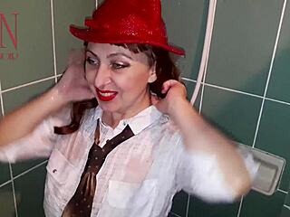 A chick stands in shower with wet clothes on