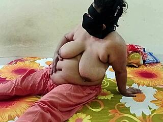 attractive indian bhabhi stands in the village ranch area